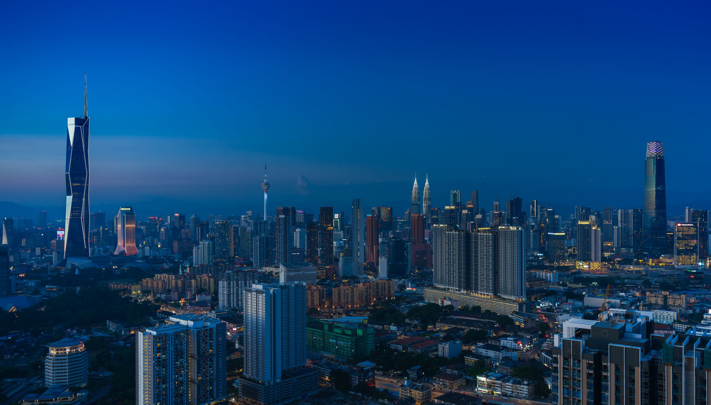 Panoramic Kuala Lumpur skyline at blue hour